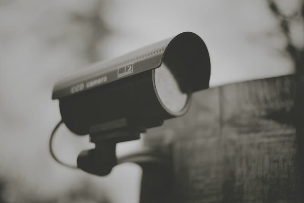 black and silver camera on black stand
