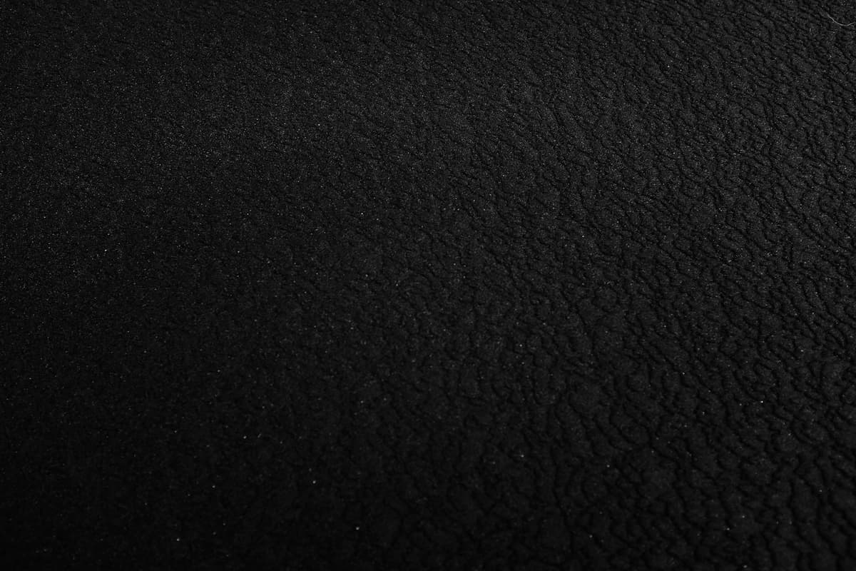 a black and white photo of a black surface