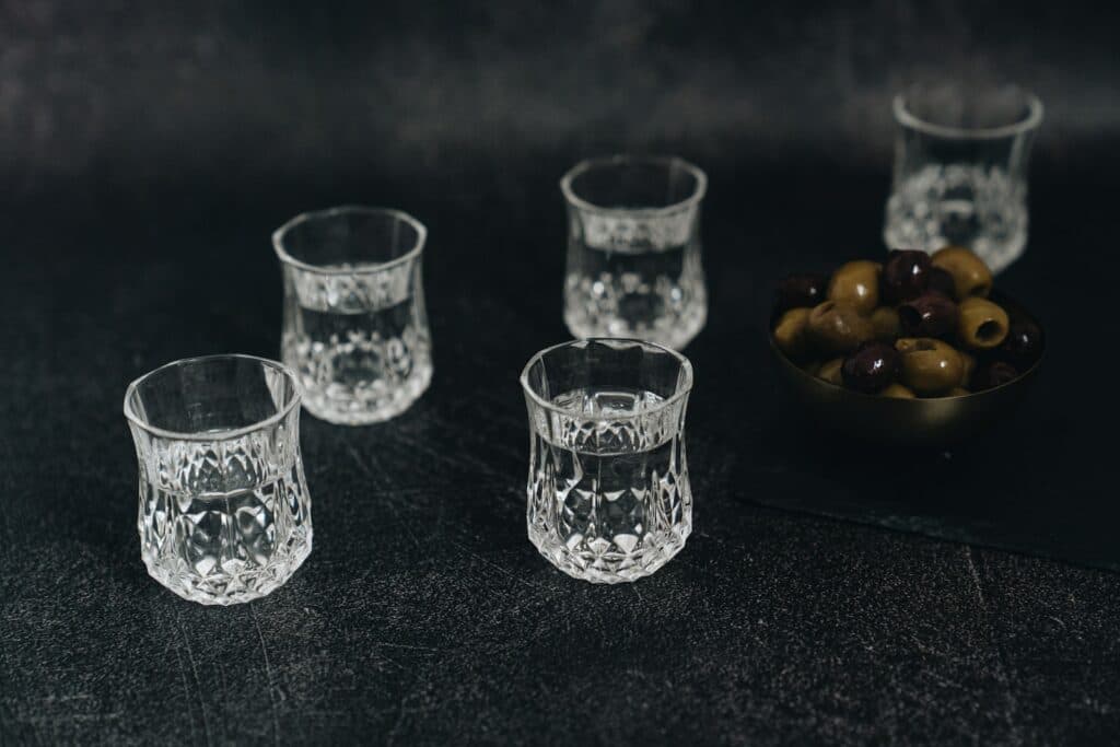 Glasses with Vodka and Bowl of Olives