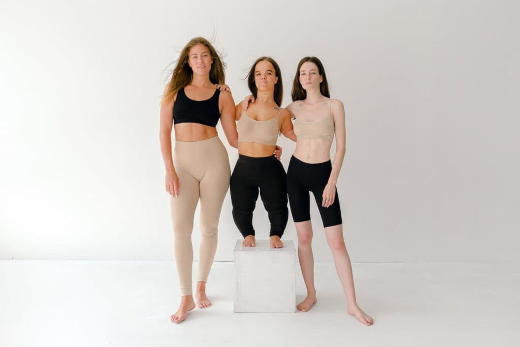 3 Women in Black and Nude Sports Bra