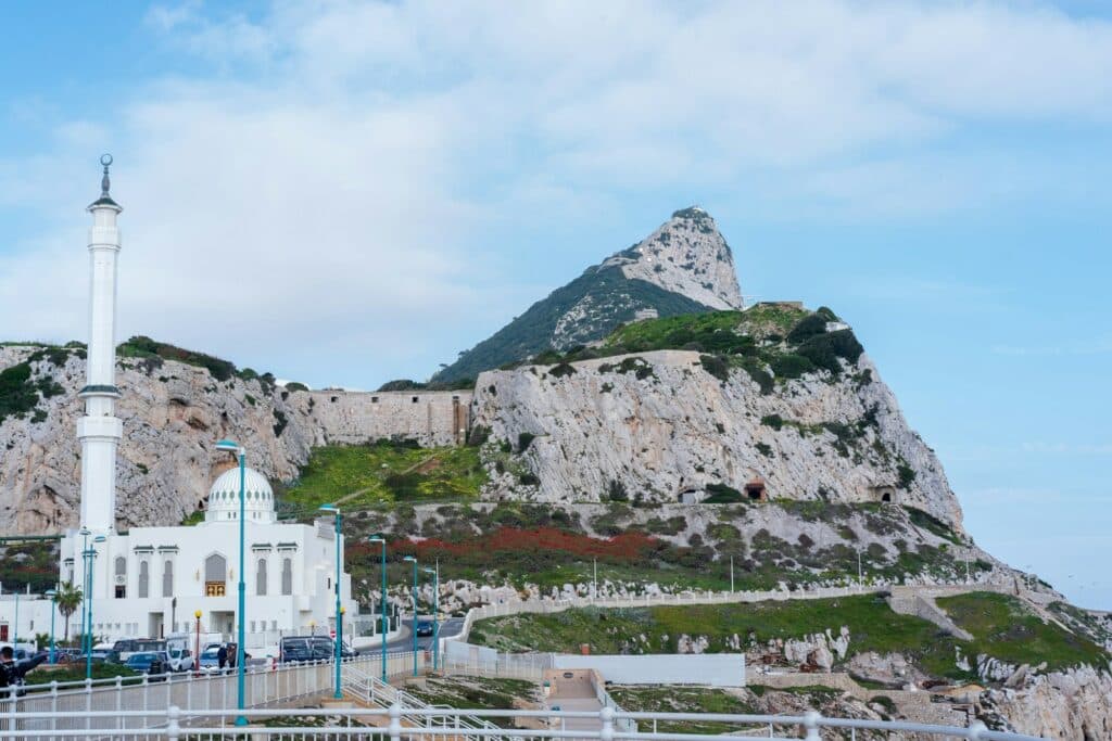 white concrete building near mountain