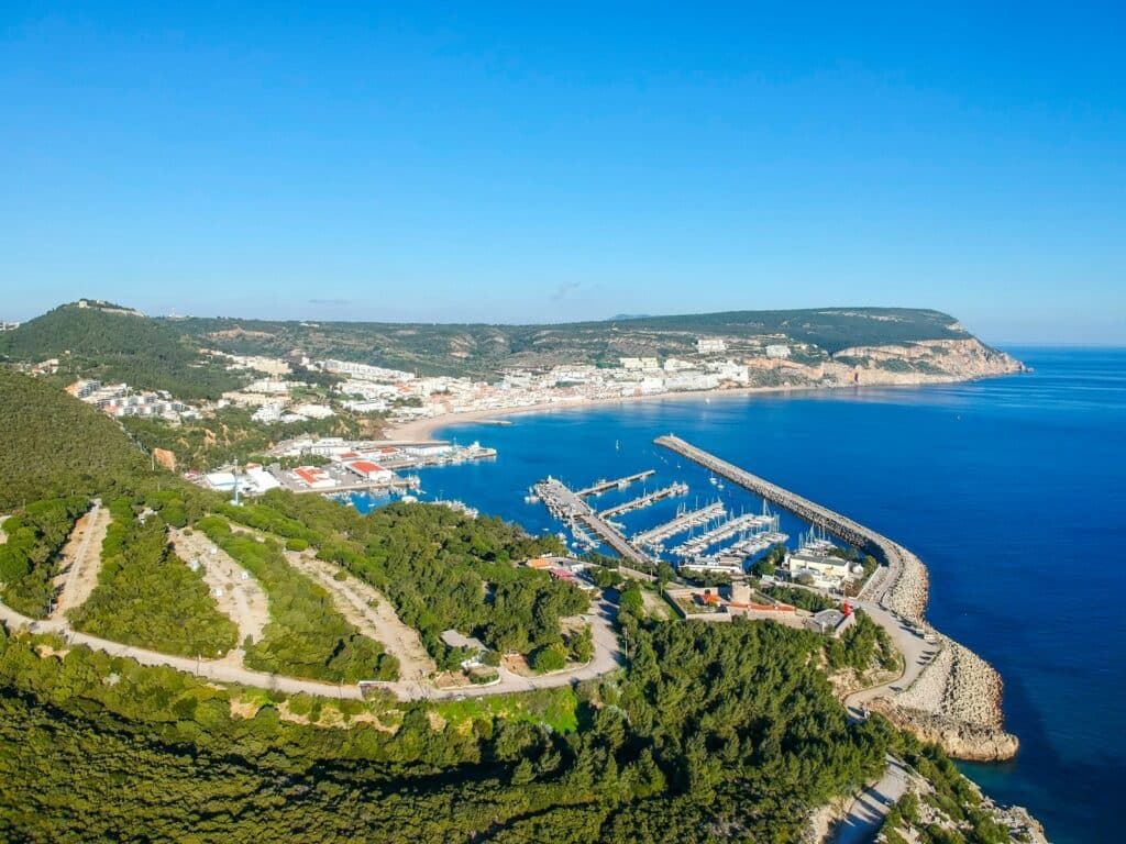 an aerial view of a marina with boats in the water