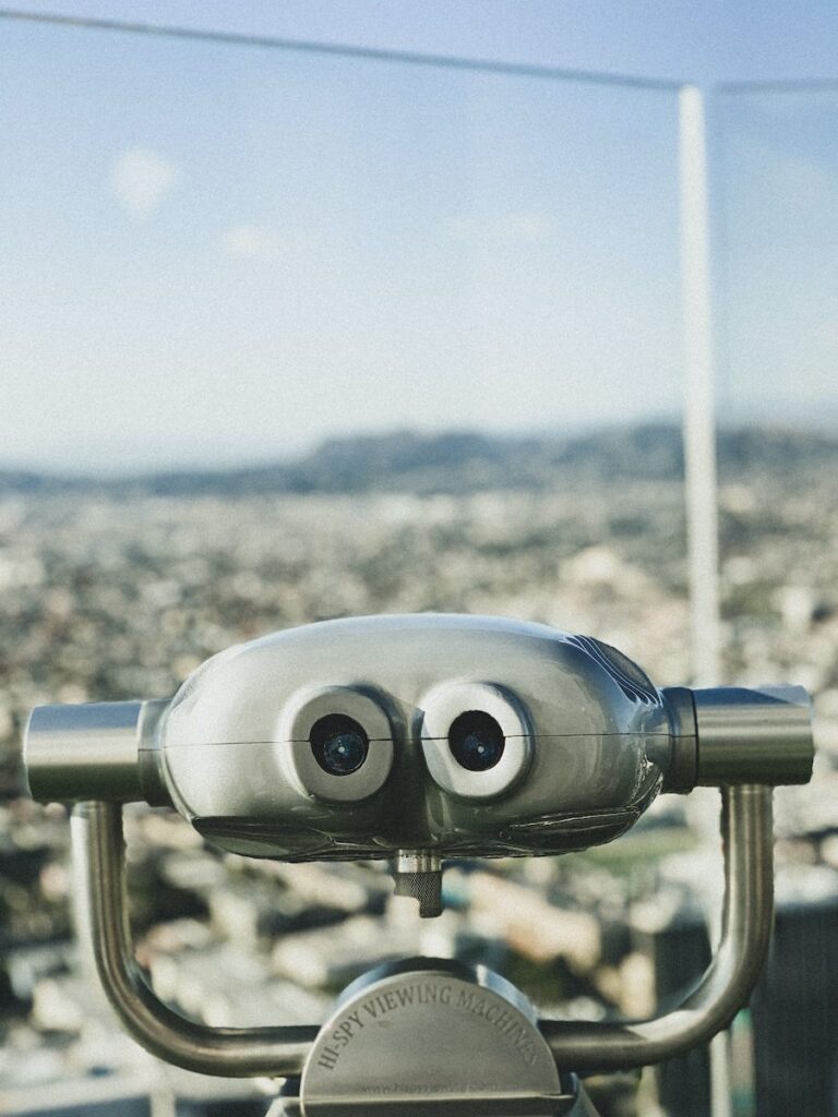 blue and gray binoculars on top of the building