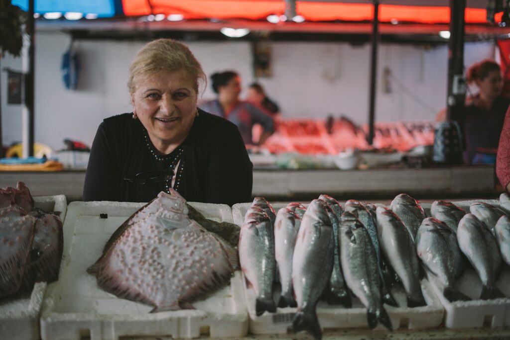 woman standing in front of fish display