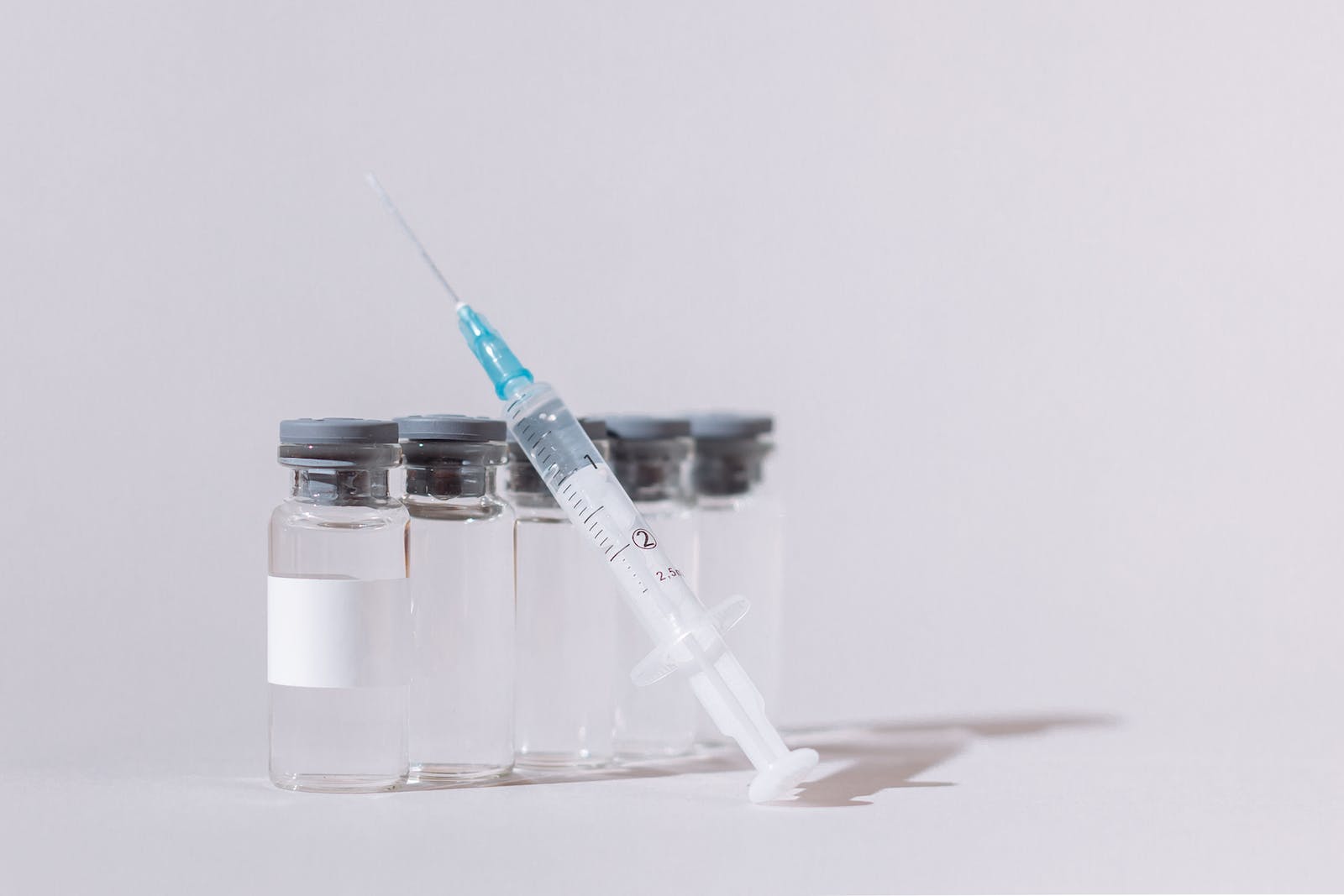 Covid Vaccine Bottles and Syringe