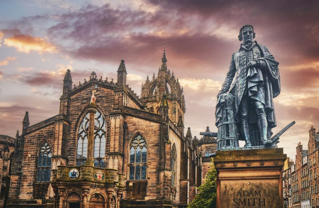 a statue of a man standing in front of a building