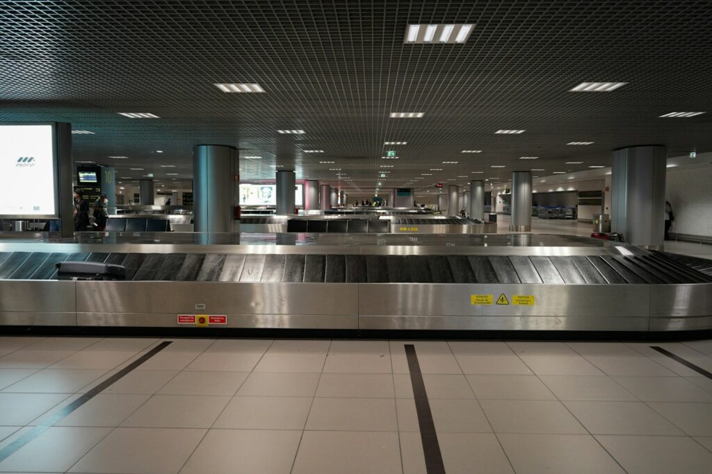 an empty baggage claim area at an airport