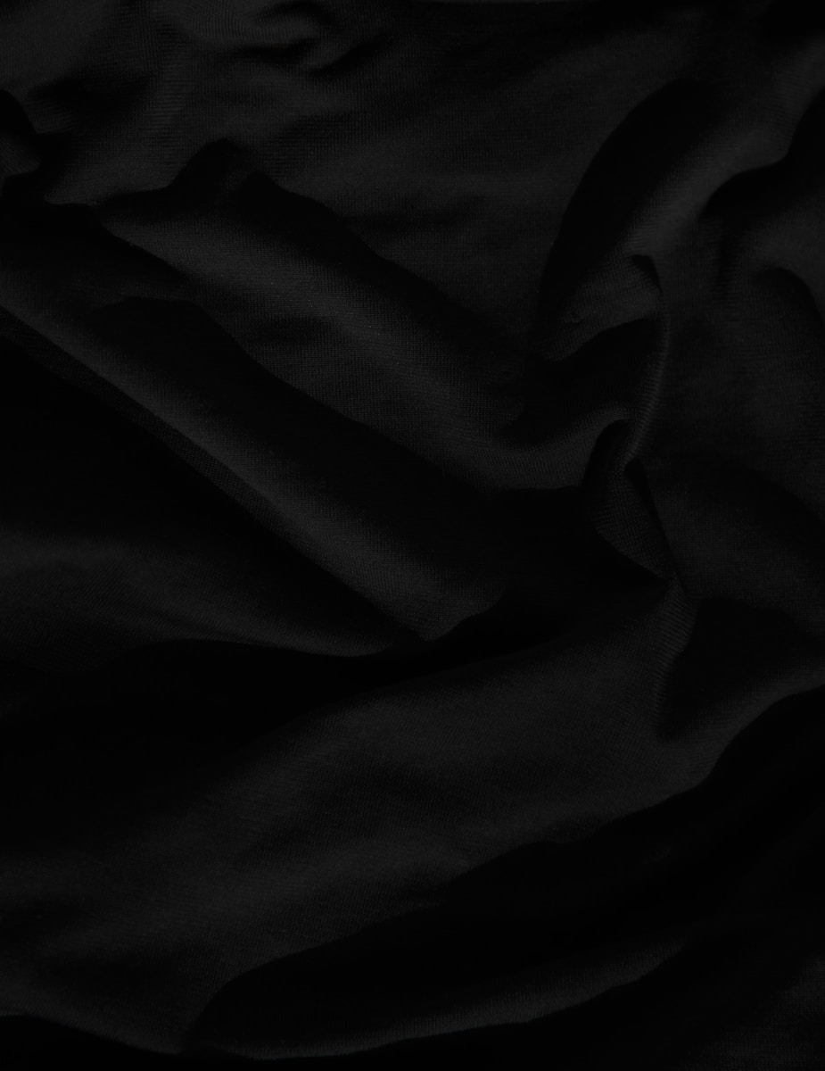 black textile on white textile